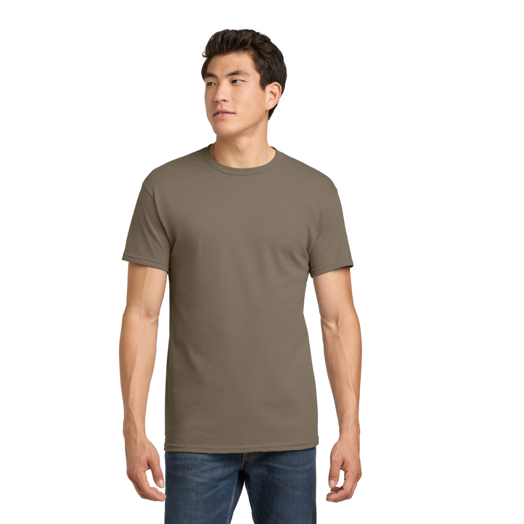Man wearing a brown t-shirt and blue jeans on a white background