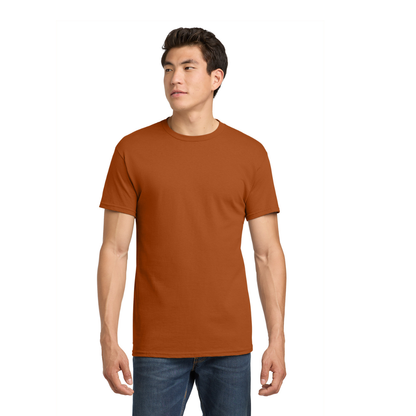 Man wearing a brown t-shirt and blue jeans on a white background