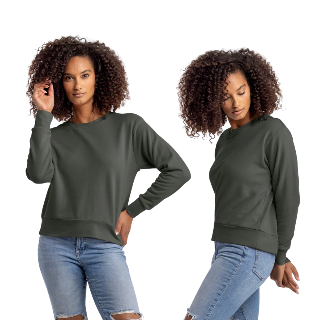 Woman wearing a dark green sweatshirt and blue jeans on a white background