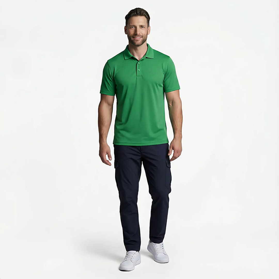 Man wearing a green polo shirt and navy pants on a white background