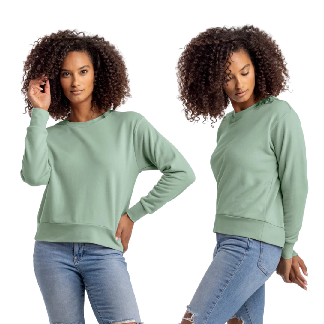 Woman wearing a green sweatshirt and blue jeans on a white background