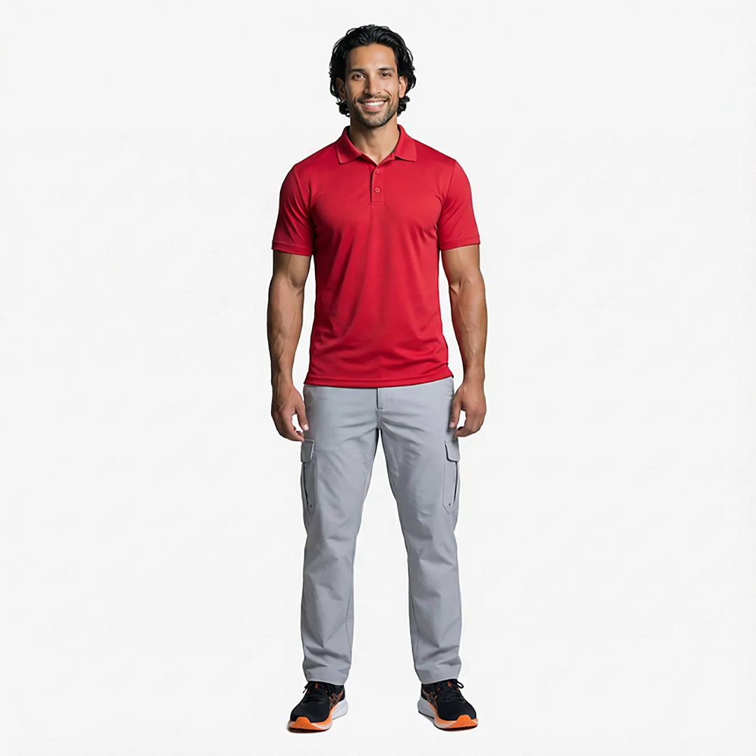 Man wearing a red polo shirt and gray pants on a white background